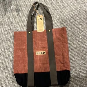 Large tote by FEED . 17x 17 w interior zip pocket. Made of canvas